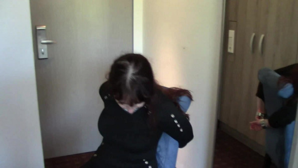 American Domme Shackled To The Chair
