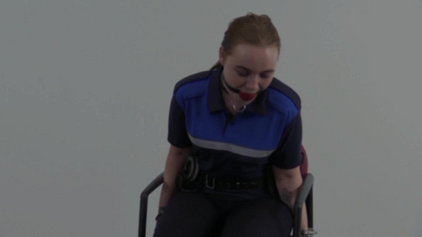 Dutch policewoman Roxy handcuffed to a chair